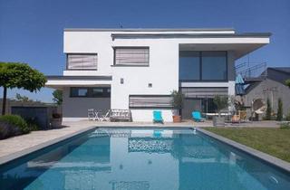 Einfamilienhaus kaufen in 7111 Parndorf, Architektenhaus mit großem Garten und Pool