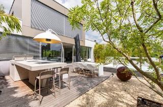 Villen zu kaufen in 7100 Neusiedl am See, Moderne High-End-Villa mit direktem Seezugang