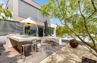 Villen zu kaufen in 7100 Neusiedl am See, Moderne High-End-Villa mit direktem Seezugang