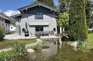 Einfamilienhaus kaufen in 6345 Kössen, Charmantes Einfamilienhaus mit Garten & Teich – Kössen | Eingetragenes Wohnrecht im Preis berücksichtigt