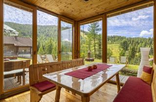 Almhütte zu kaufen in 9571 Hochrindl, Gemütliches Almhaus am Hochrindl - Weitläufiges Grundstück mit Blick über sonnige Berggipfel.