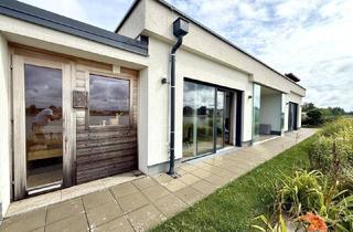 Haus kaufen in 7111 Parndorf, EXKLUSIVER BUNGALOW AM SEE - ERSTE REIHE MIT TRAUMHAFTEM AUSBLICK