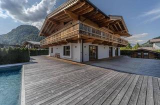 Haus kaufen in 6345 Kössen, Alpenchalet mit Outdoor Pool und Saunahaus