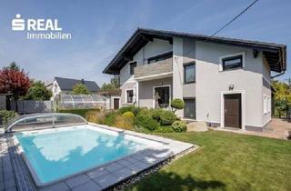 Einfamilienhaus kaufen in 1220 Wien, Urlaubsfeeling mit wunderschönem Haus - Pool & Traumgarten - Wohnen auf höchstem Niveau