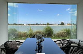 Haus kaufen in 7111 Parndorf, EXKLUSIVER BUNGALOW AM SEE - ERSTE REIHE MIT TRAUMHAFTEM AUSBLICK