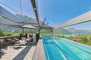 Villen zu kaufen in 6212 Maurach, Terrassenvilla mit Infinity Pool, zwei zusätzlichen Wohneinheiten und Panoramablick über dem Achensee