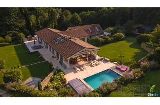 Haus kaufen in 3012 Wolfsgraben, Traumhaftes Chalet in Wolfsgraben mit beeindruckendem Innenpool und exzellenter Gartengestaltung