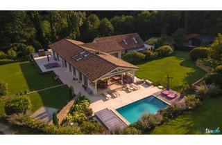 Haus kaufen in 3012 Wolfsgraben, Traumhaftes Chalet in Wolfsgraben mit beeindruckendem Innenpool und exzellenter Gartengestaltung