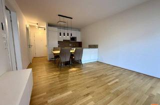 Wohnung kaufen in 2435 Ebergassing, Moderne 2-Zimmer-Wohnung mit großem Balkon und Tiefgaragenparkplatz