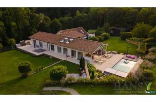 Haus kaufen in 3012 Wolfsgraben, WOLFSGRABEN - Beeindruckendes Chalet mit großem Innenpool und traumhafter Gartengestaltung