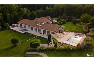 Haus kaufen in 3012 Wolfsgraben, WOLFSGRABEN - Beeindruckendes Chalet mit großem Innenpool und traumhafter Gartengestaltung