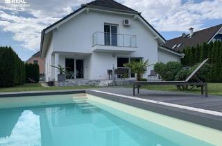 Einfamilienhaus kaufen in 2473 Potzneusiedl, Luxuriöses Wohnen: Designhaus mit Garten, Pool und geräumiger Garage