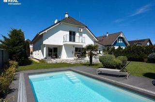 Einfamilienhaus kaufen in 2473 Potzneusiedl, Stilvolles Designhaus mit Pool und großzügige Garage – Wohnen auf höchstem Niveau