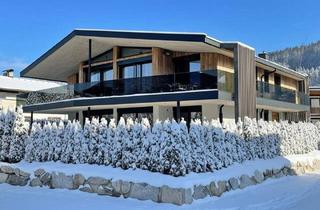 Wohnung kaufen in 6380 Sankt Johann in Tirol, Exklusive Garten-Villenetage mit Pool und Hornblick!