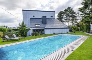 Haus kaufen in Eichbüchler Gasse, 2700 Wiener Neustadt, Außergewöhnliches Designerhaus mit viel Raum zur Entfaltung | 8 Zimmer, Edelstahlpool, Sauna, Weinkeller | Vereint Wohnen und Arbeiten | Barrierefrei