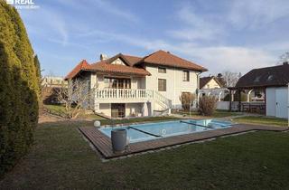 Einfamilienhaus kaufen in 2401 Fischamend-Dorf, Stilvolles Einfamilienhaus mit Keller, Pool und traumhaftem Garten – Wohnen in ruhiger Lage nahe Wien