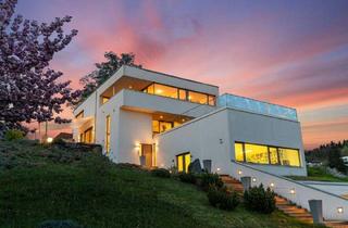 Villen zu kaufen in 9210 Pörtschach am Wörther See, Exklusive Architektenvilla mit Pool und Seeblick