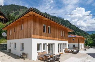 Haus kaufen in 9873 Döbriach, Etabliertes Ferienhaus-Ensemble am Millstätter See. Zwei moderne Häuser mit bestehender Vermietung. Investment.