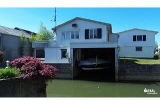 Immobilie kaufen in 6971 Hard, Ferienhaus mit Bootsgarage inklusive Motorboot