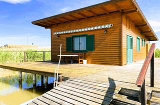 Haus kaufen in 7072 Mörbisch am See, Ein Logenplatz am Wasser – Exklusive Seehütte auf Eigengrund im Neusiedler See!
