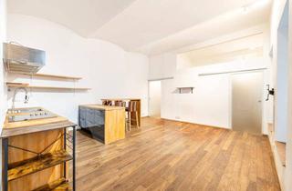 Wohnung kaufen in 1070 Wien, Charmante Altbauwohnung im 7. Bezirk mit Garten