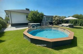 Haus kaufen in 2231 Strasshof an der Nordbahn, Top Ausstattung! 2 Garagen Pool, Kamin, Moderner Bungalow in Strasshof