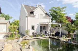 Einfamilienhaus kaufen in Podlahagasse, 1220 Wien, EINFAMILIENHAUS MIT SCHWIMMTEICH – KACHELOFEN – UNEINSEHBARER GARTEN – RUHIGE GRÜNLAGE – IDYLLISCHE WOHNOASE – ZIEGELIT MASSIVHAUS