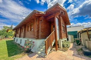 Haus kaufen in 1210 Wien, Chalet-Feeling mitten in Donaufeld - Naturstamm-Blockhaus mit Sauna, Kamin und Garten
