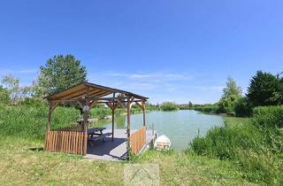 Haus kaufen in 2054 Alberndorf im Pulkautal, Holzhaus mit Garten und privatem Seezugang – Wohnen, wo andere Urlaub machen!