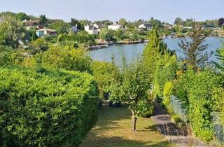 Haus kaufen in 2491 Neufeld an der Leitha, Uferparzelle am Steinbrunner See mit entzückendem Ferienhaus