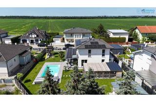 Einfamilienhaus kaufen in 2231 Strasshof an der Nordbahn, "EIN HAUS, DAS ALLE STÜCKERL SPIELT" - ENERGIEEFFIZIENTES HAUS MIT 4 ZIMMERN, SWIMMINGPOOL, RIESIGEM KELLER UND KLIMAANLAGE