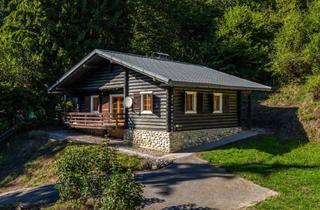 Haus kaufen in Köstenberger Straße 344, 9220 Velden am Wörther See, Holzblockhaus mit Charme - 3 Zimmer, Balkon & Kamin!