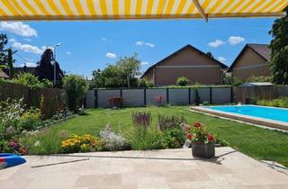 Wohnung kaufen in 1210 Wien, Traumhafte 4-Zimmer-Gartenwohnung mit Pool, Sauna und 530 m² Eigengarten
