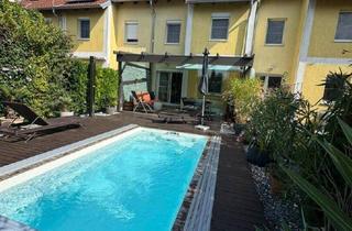 Reihenhaus kaufen in 2333 Leopoldsdorf, "Wohnen am Teich" Leopoldsdorf – Stilvolles Reihenhaus mit hochwertiger Ausstattung, Wintergarten & Pool