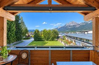 Wohnung kaufen in 6380 Sankt Johann in Tirol, Charmante Dachgeschoss-Wohnung mit Ausblick und drei Schlafzimmern