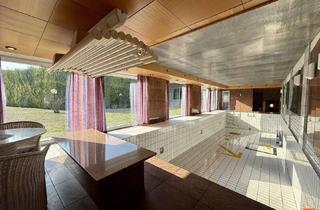 Einfamilienhaus kaufen in 2483 Weigelsdorf, Großzügiges Einfamilienhaus mit beeindruckender Schwimmhalle, weitläufigem Kellerbereich und direkter Garagenanbindung