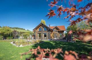 Einfamilienhaus kaufen in 5302 Henndorf am Wallersee, Naturjuwel am Wallersee — massives Fichtenblockhaus auf außergewöhnlichem Grund